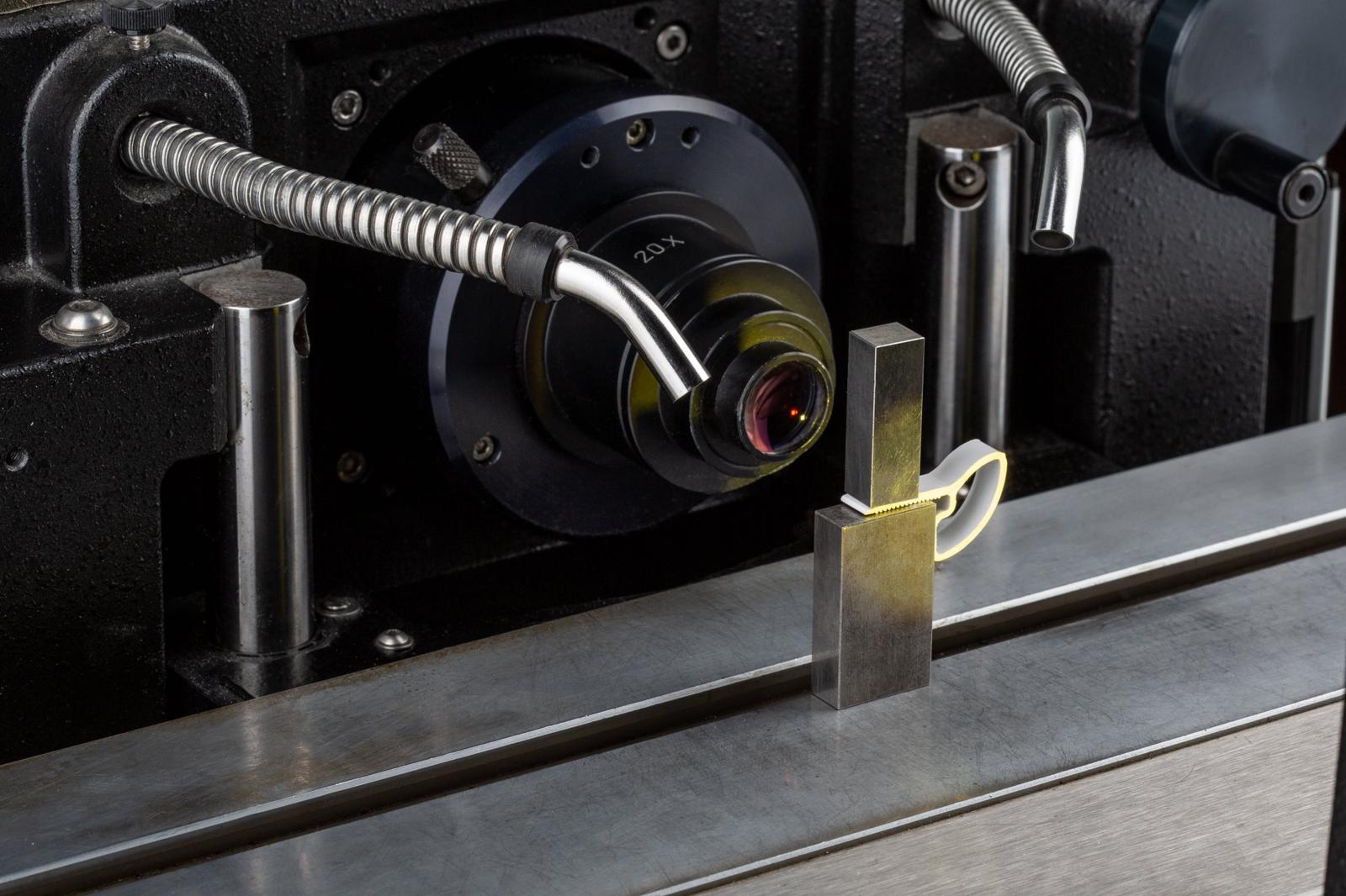 Metal forming machine bending a workpiece in a workshop