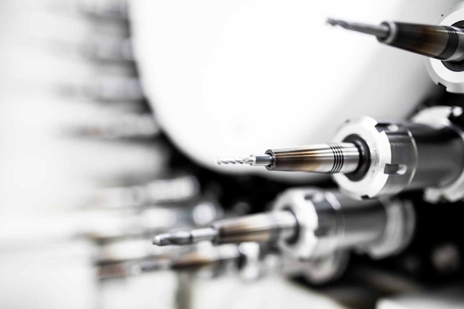 Rows of precision machined metal shafts produced in volume