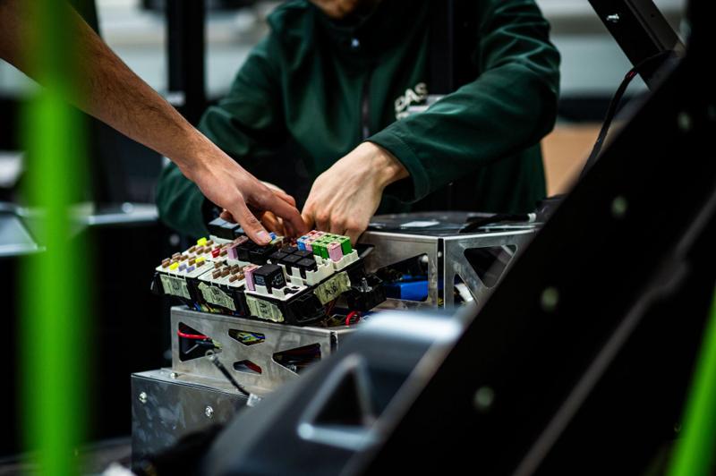 DASIS technician assembling electronic components in a rig