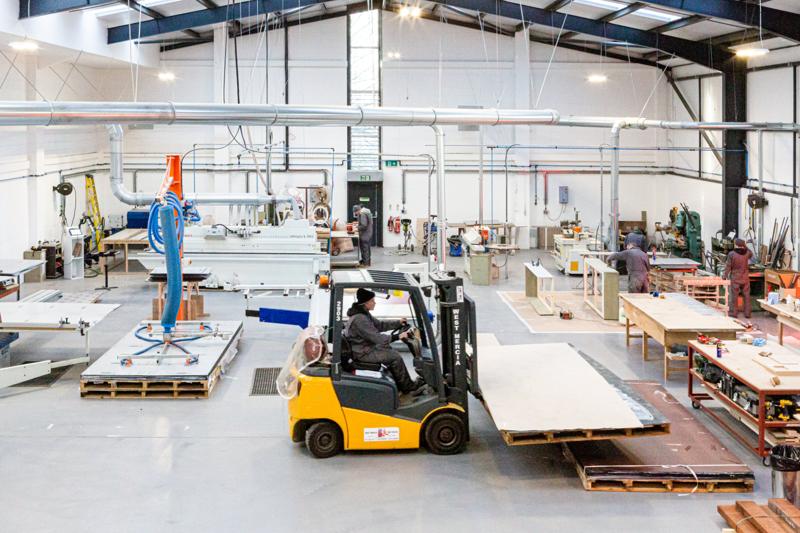 JCM Fine Joinery workshop with a forklift moving timber