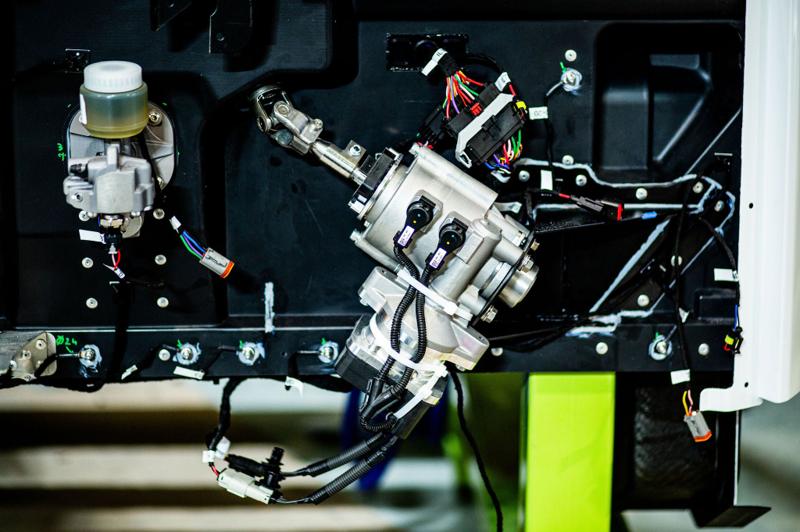 Detail of an electronics assembly in a green-lit rig at DASIS