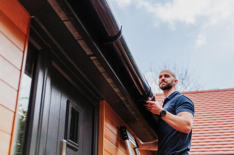 Pallant Surveyors team member inspecting a property exterior