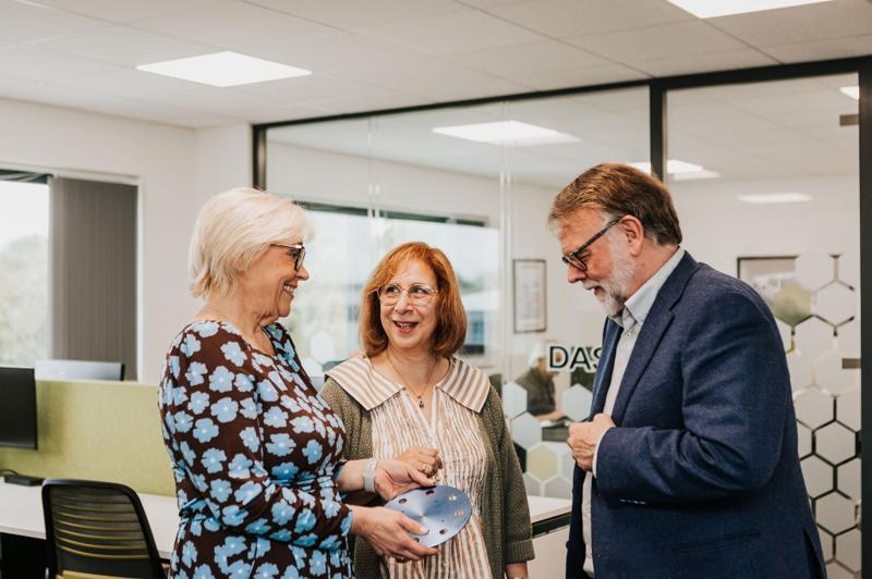Professionals networking and talking in a meeting room