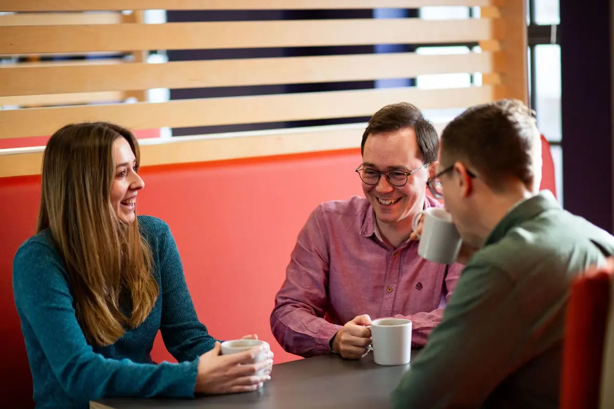 Two people in conversation, illustrating marketing for advanced manufacturing and technical businesses