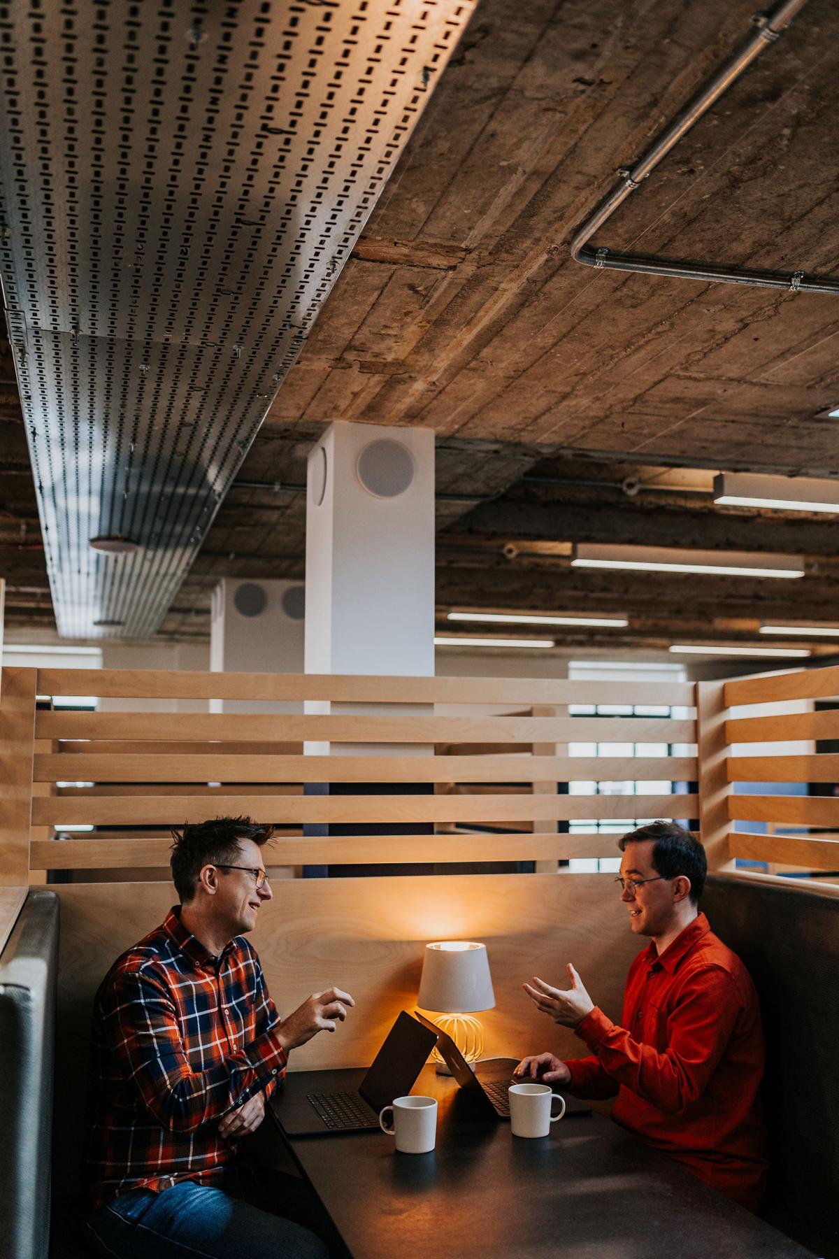 Two Pallant consultants meeting in a studio booth