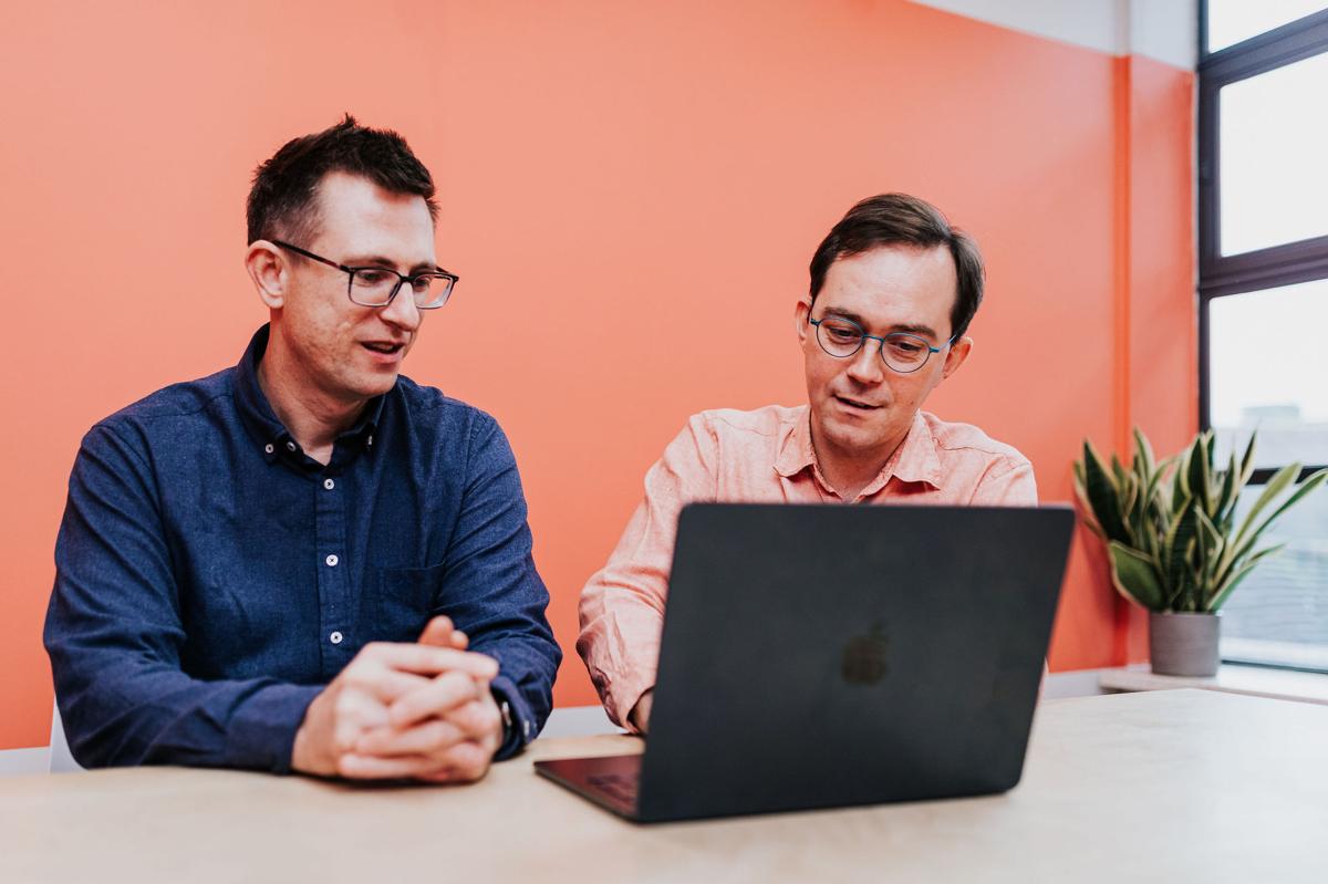 Two Pallant marketing consultants working at a laptop