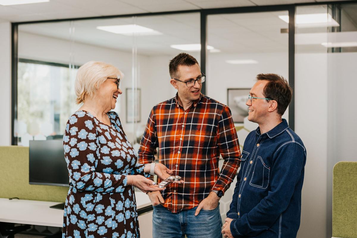 Pallant marketing team discussing strategy together in the office