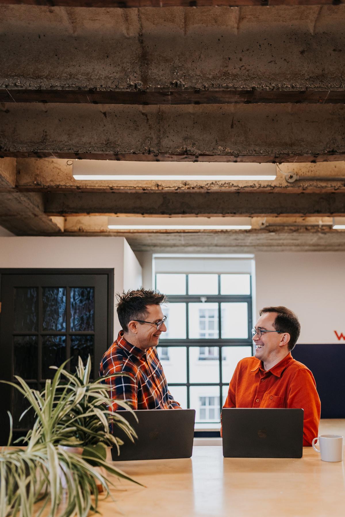 Pallant team members working at a studio desk