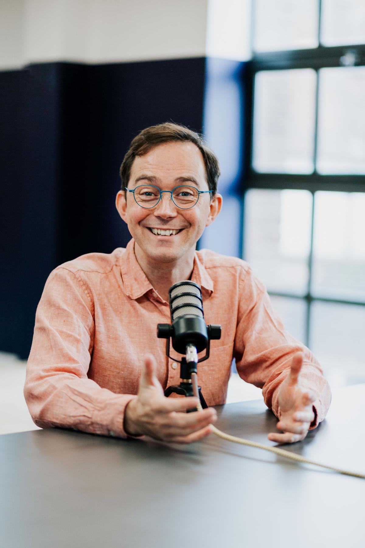 Simon Batchelar recording a video in the studio
