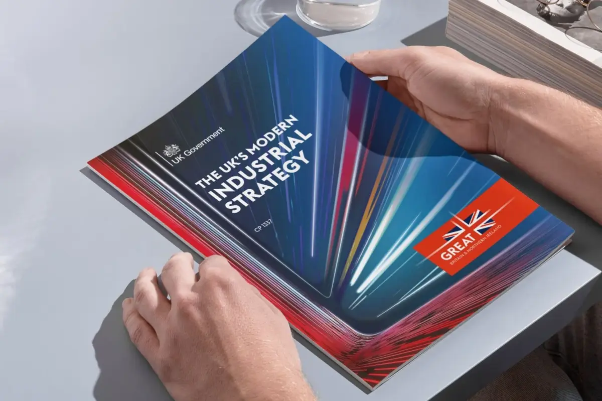The UK Modern Industrial Strategy report held in hand